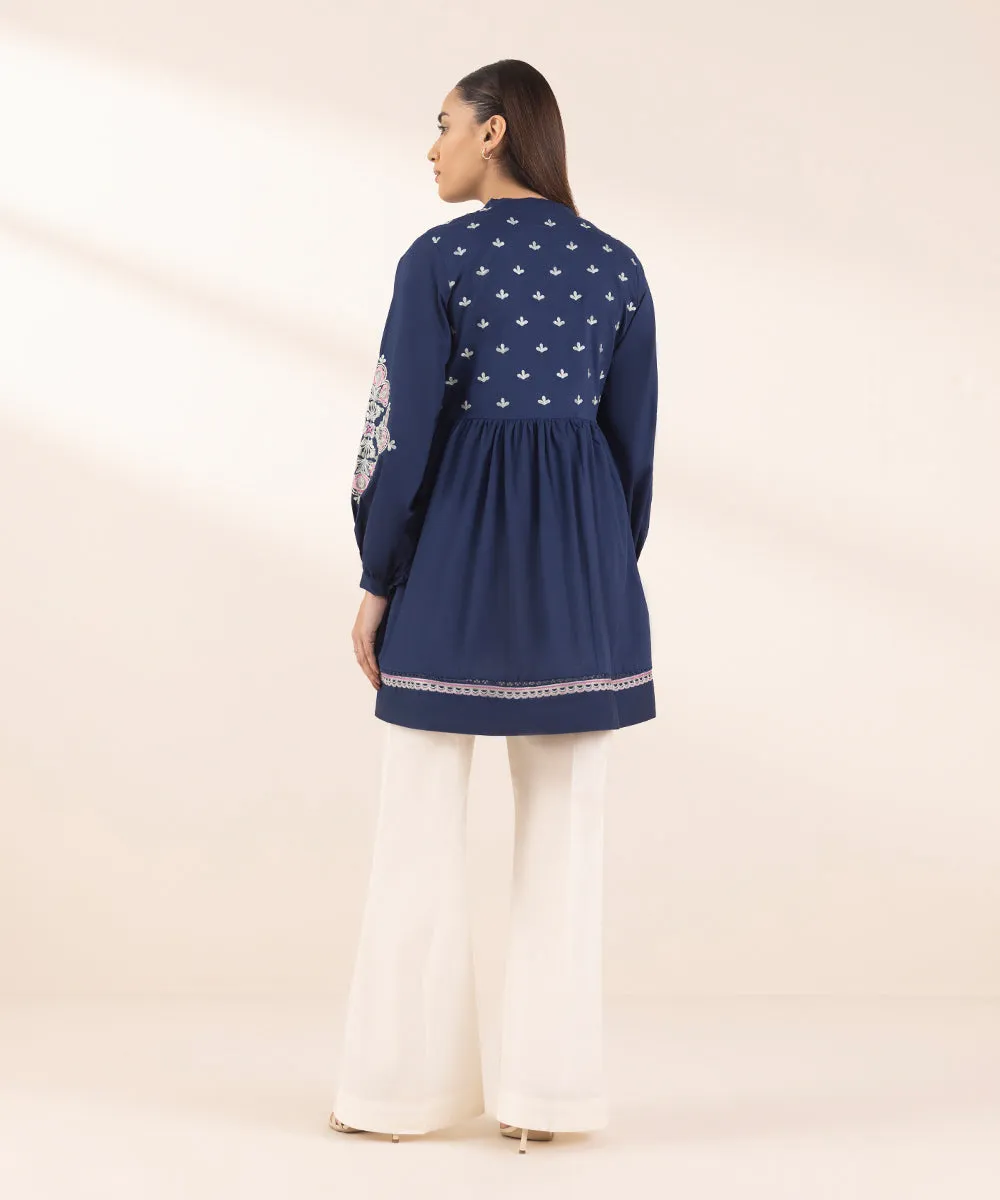 Embroidered Peplum Top