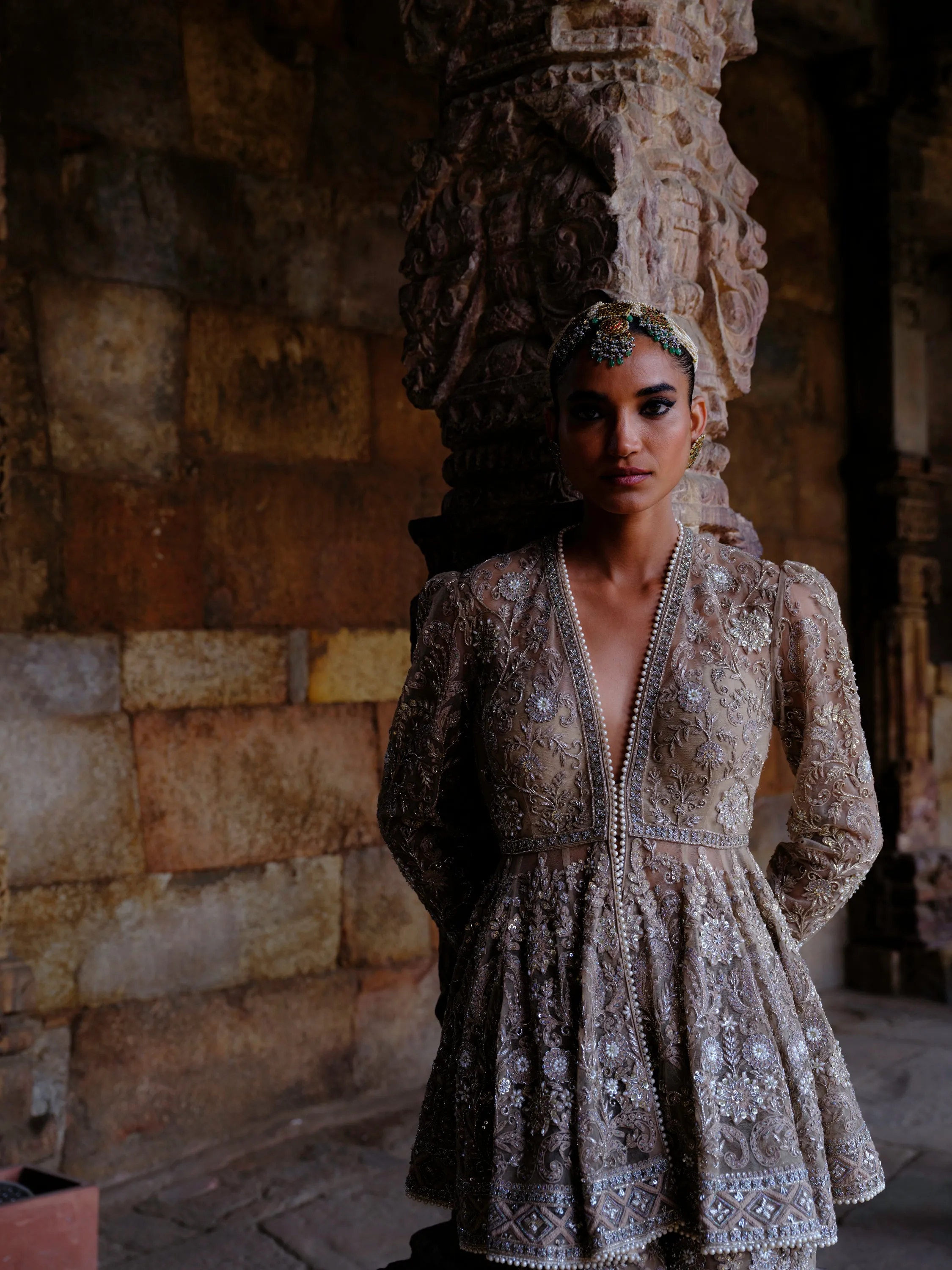 Featuring a peplum in net base with zari embroidery.