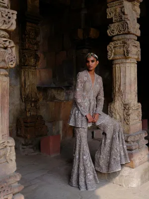 Featuring a peplum in net base with zari embroidery.