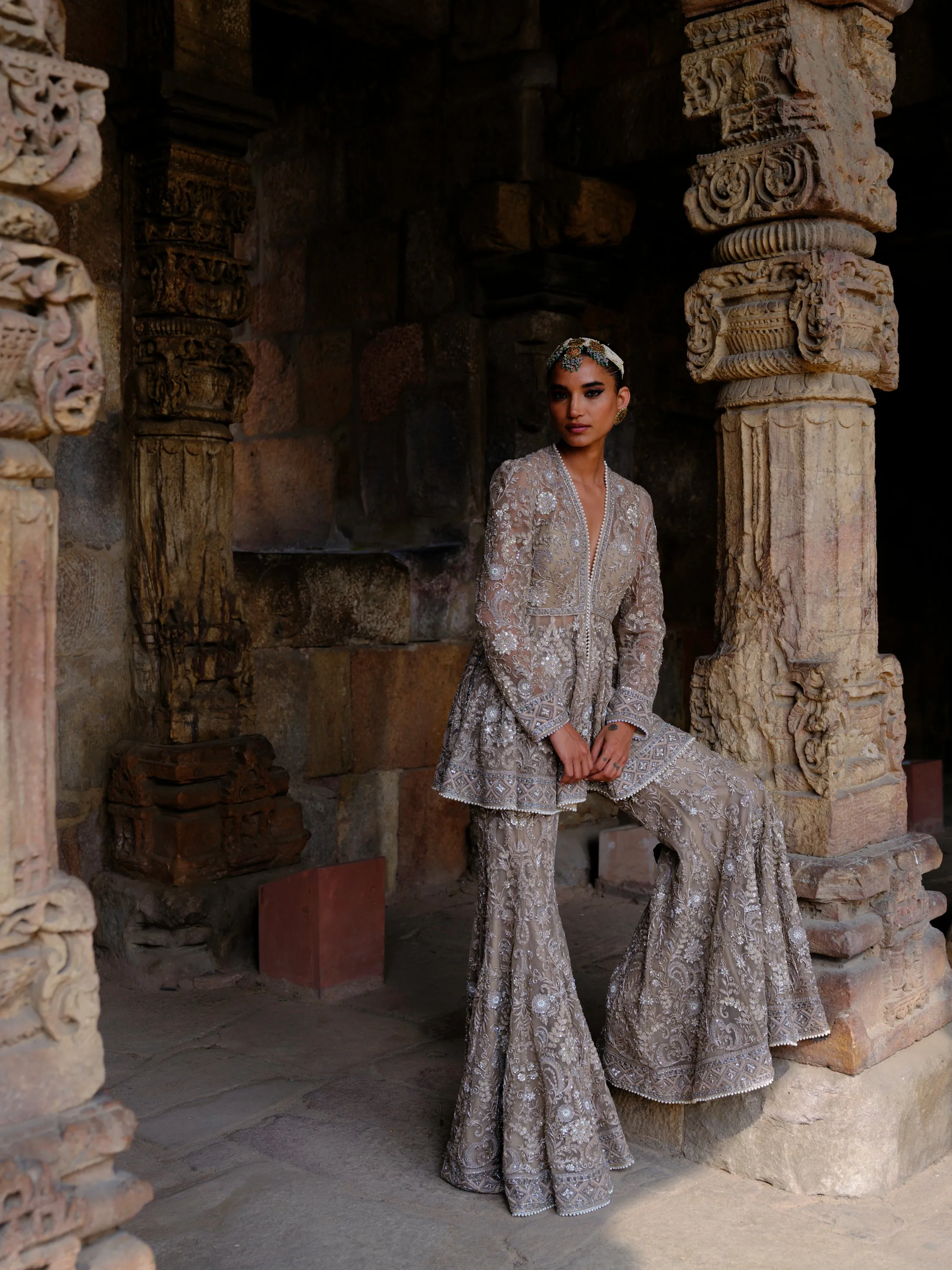 Featuring a peplum in net base with zari embroidery.