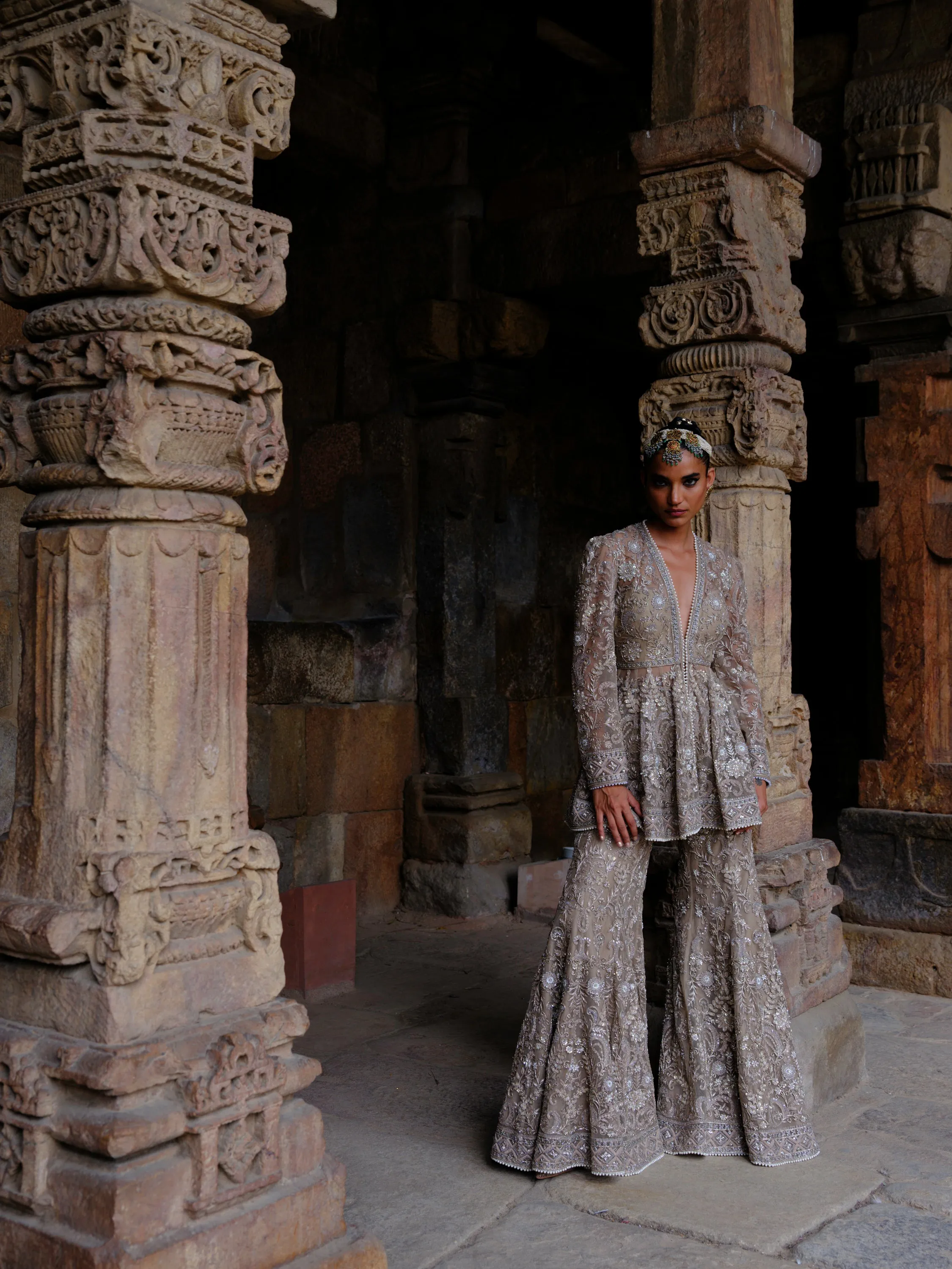 Featuring a peplum in net base with zari embroidery.