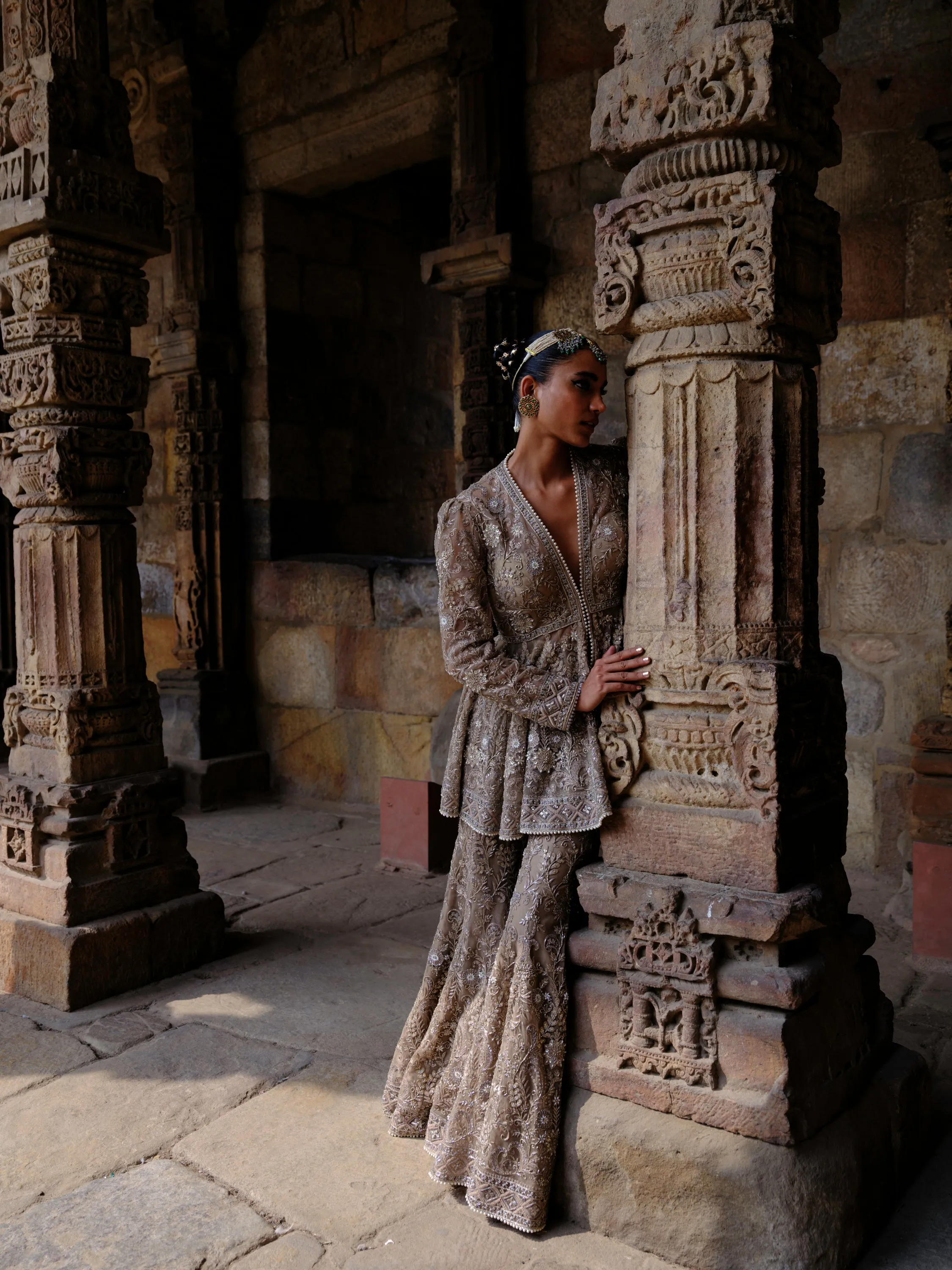 Featuring a peplum in net base with zari embroidery.