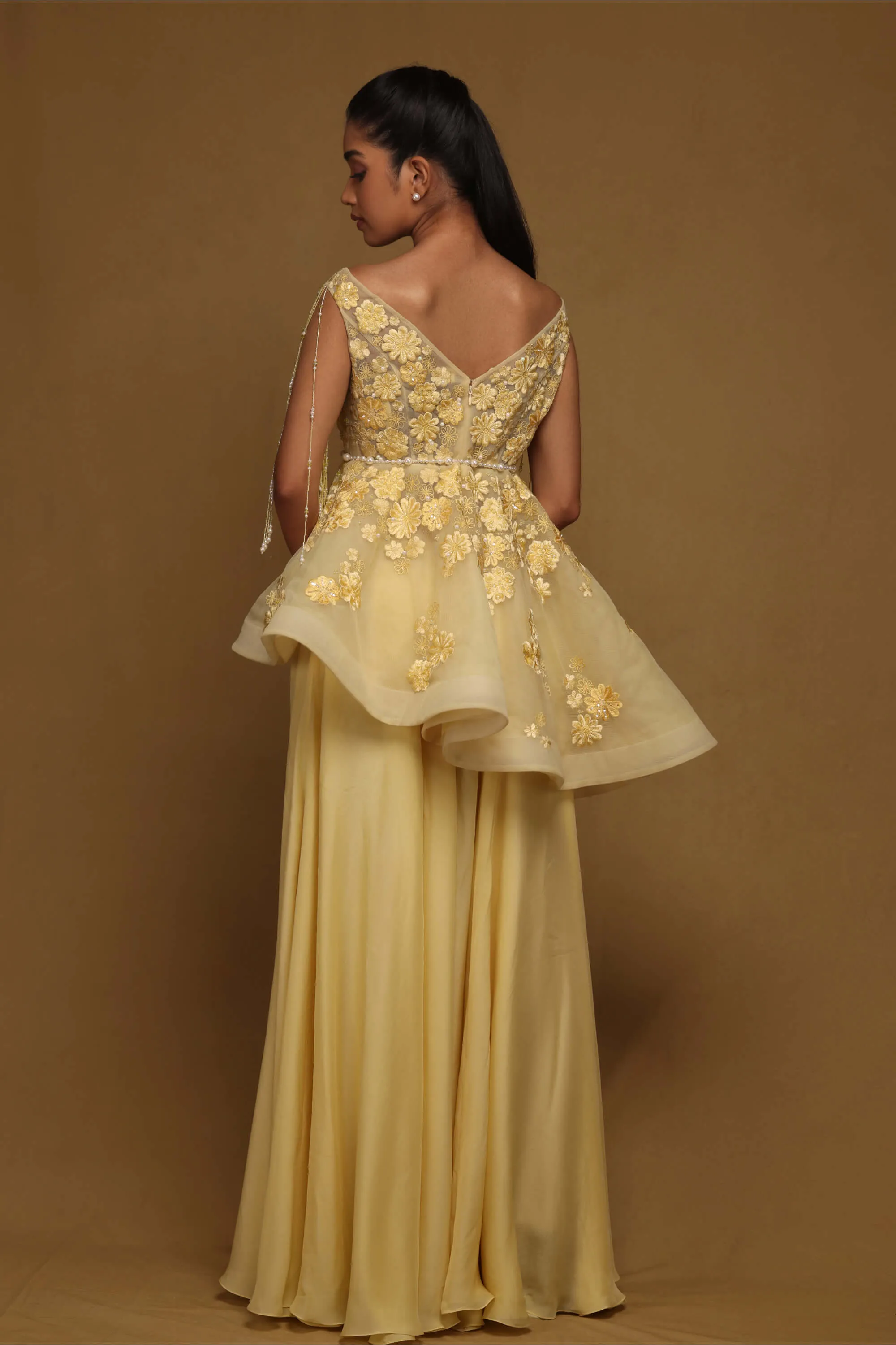 Yellow peplum and flared pant set