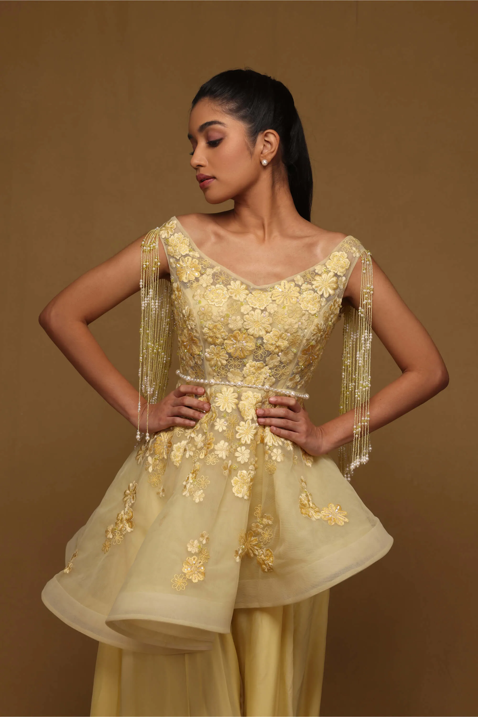 Yellow peplum and flared pant set